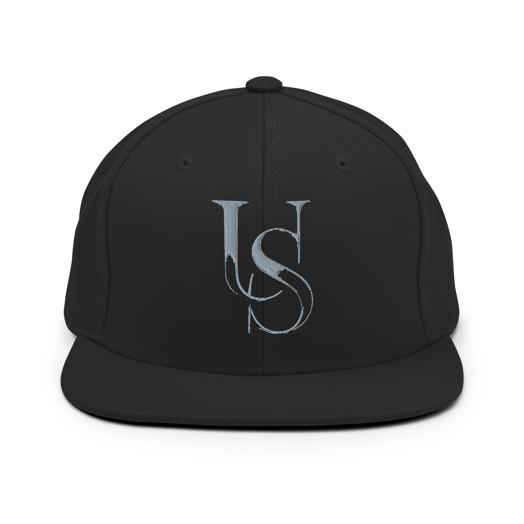 Black flat-brim snapback, front view, with the grey US monogram embroidered in 3D puff.